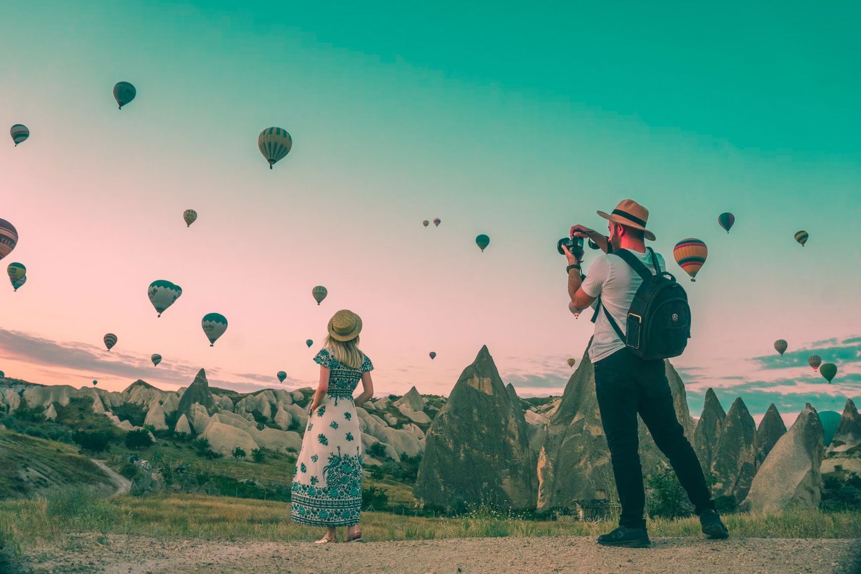 People taking photos of hot-air balloons